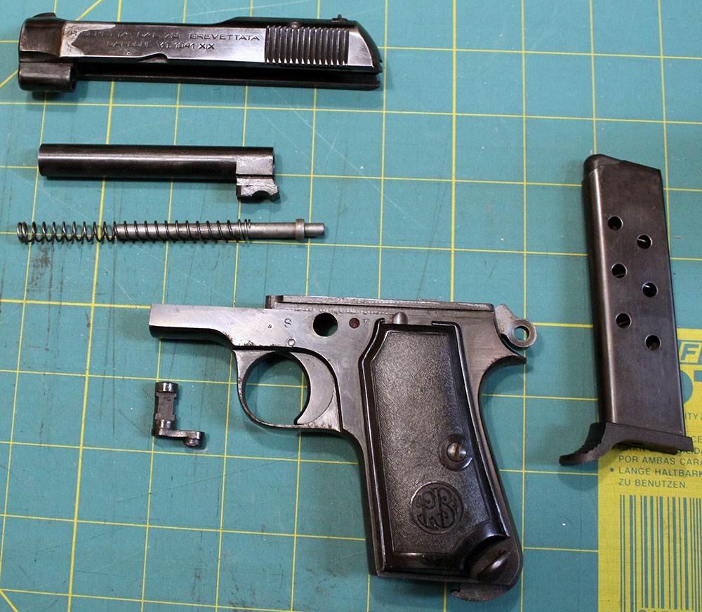 Disassembled Beretta M1935, laid out on a crafting mat